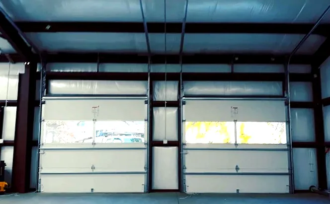 Two commercial sectional doors with window sections