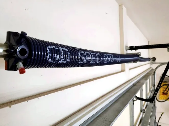Close-up of a new torsion spring on the shaft